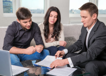 couple in san antonio meeting with a small business attorney